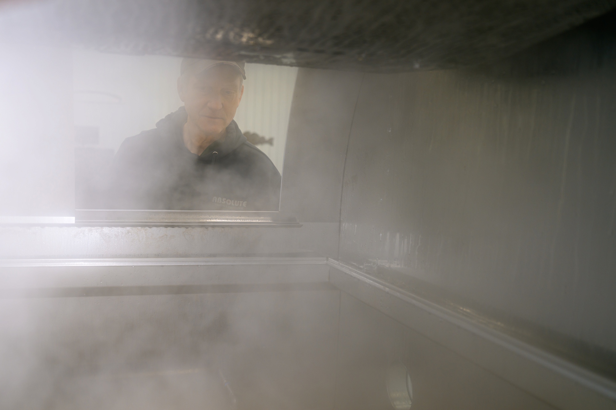 Greg watching steam rise off the evaporator in the sugarhouse