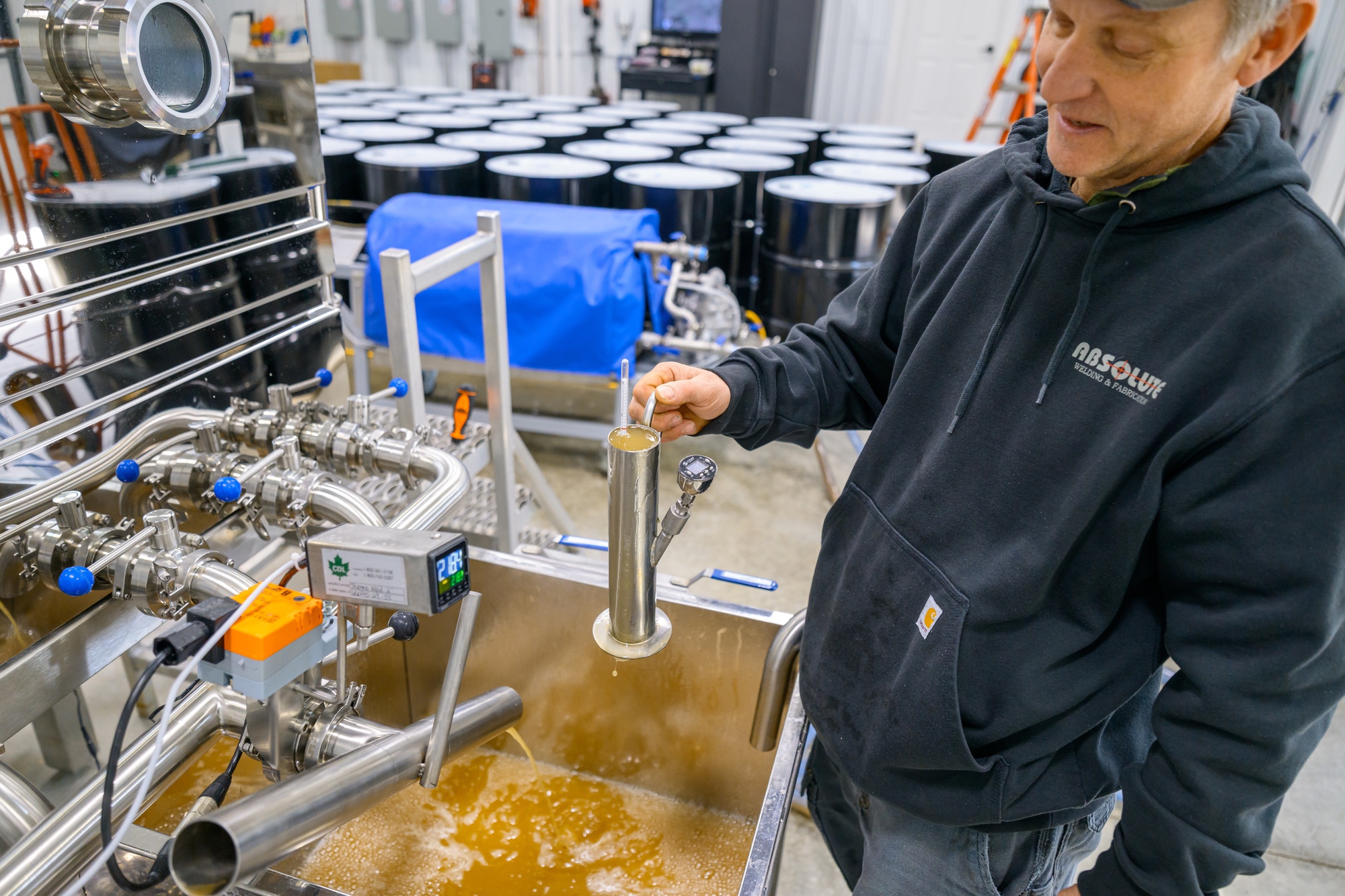 Testing syrup density as fresh sap boils down
